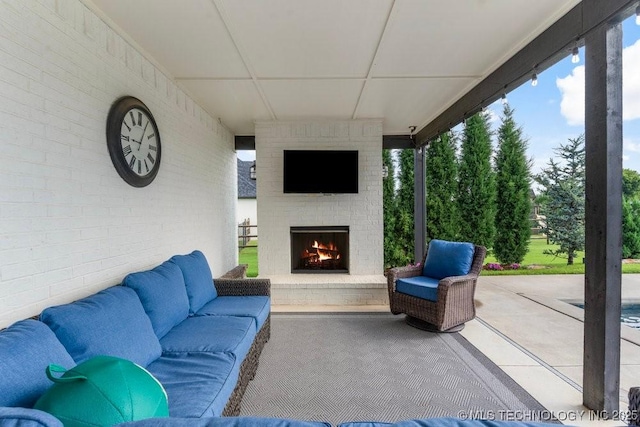 19021 E Chokeberry St, Owasso, OK 74055 - view of patio / terrace with an outdoor living space with a fireplace