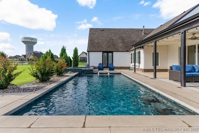 19021 E Chokeberry St, Owasso, OK 74055 - view of pool featuring a patio, a pool with connected hot tub, french doors, and outdoor lounge area