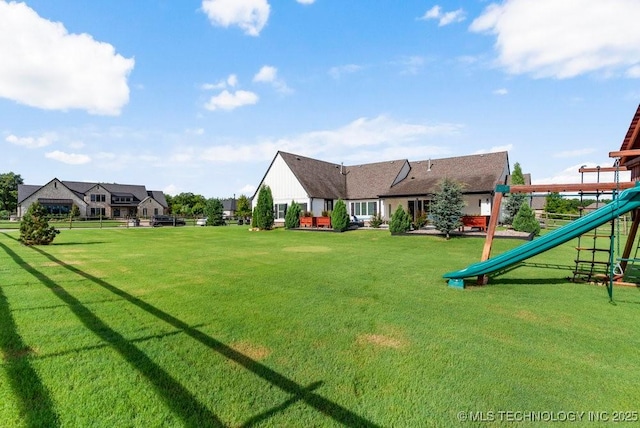 19021 E Chokeberry St, Owasso, OK 74055 - view of green lawn with a playground