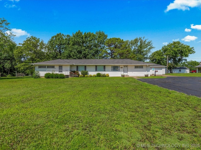 123 S Madison Blvd, Bartlesville, OK 74006 - ranch-style home featuring a front yard and a garage