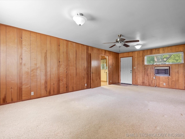123 S Madison Blvd, Bartlesville, OK 74006 - spare room with carpet floors, ceiling fan, and wooden walls