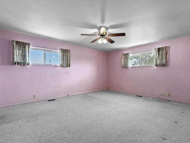 123 S Madison Blvd, Bartlesville, OK 74006 - carpeted spare room with ceiling fan and baseboards