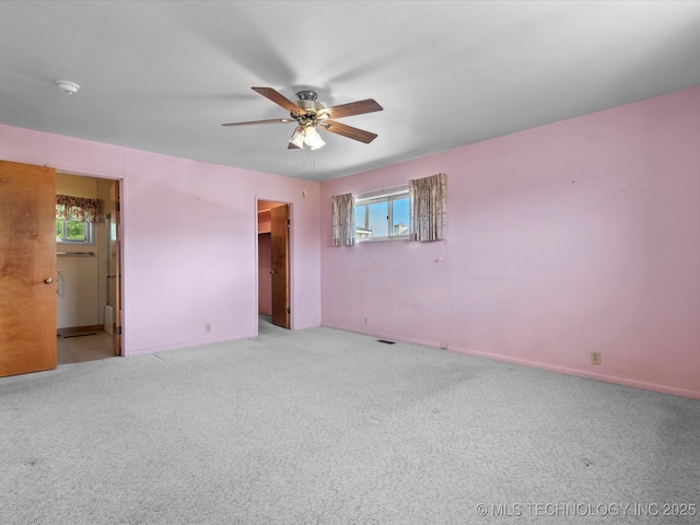 123 S Madison Blvd, Bartlesville, OK 74006 - carpeted spare room with ceiling fan and a smoke detector