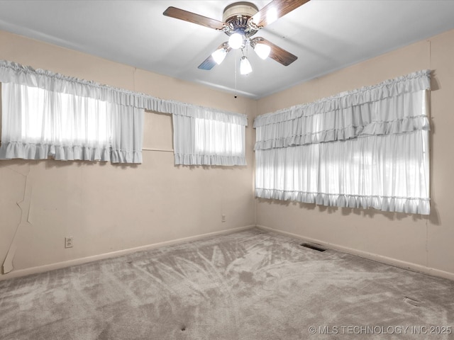 123 S Madison Blvd, Bartlesville, OK 74006 - carpeted empty room with baseboards and ceiling fan