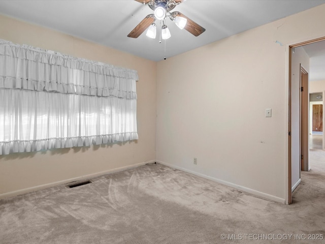 123 S Madison Blvd, Bartlesville, OK 74006 - spare room featuring carpet flooring and ceiling fan