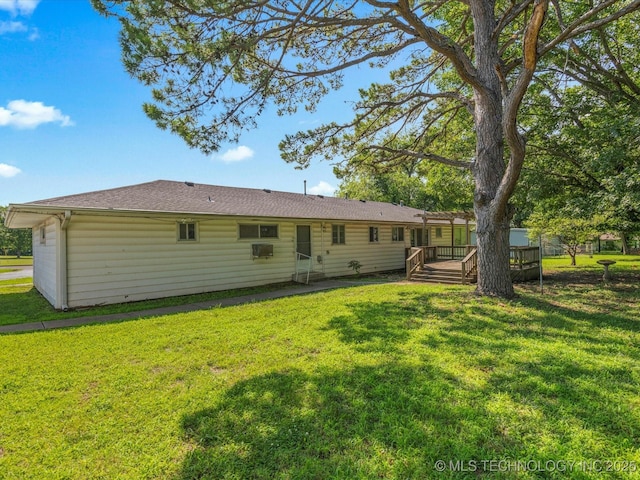 123 S Madison Blvd, Bartlesville, OK 74006 - rear view of house with a wooden deck and a lawn