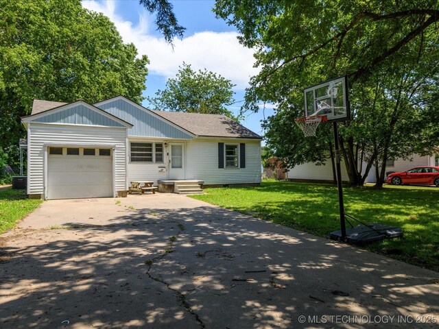 105 E Brahma Ave, Dewey, OK 74029 - view of front of property with concrete driveway, a garage, roof with shingles, and a front yard