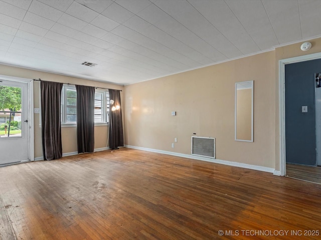 105 E Brahma Ave, Dewey, OK 74029 - spare room featuring a smoke detector, wood-type flooring, and crown molding