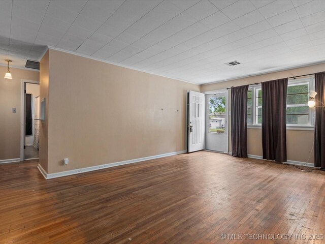 105 E Brahma Ave, Dewey, OK 74029 - empty room featuring wood-type flooring and ornamental molding