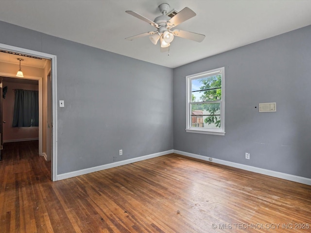 105 E Brahma Ave, Dewey, OK 74029 - unfurnished room with ceiling fan and wood finished floors