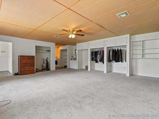 105 E Brahma Ave, Dewey, OK 74029 - unfurnished bedroom featuring wood ceiling, carpet, washer / dryer, and a ceiling fan
