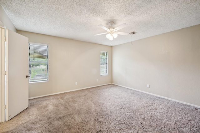 612 S 5th St, Eufaula, OK 74432 - carpeted spare room featuring plenty of natural light, a ceiling fan, and a textured ceiling