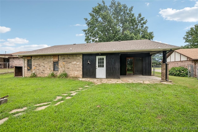 612 S 5th St, Eufaula, OK 74432 - rear view of house with a patio, a gate, a shingled roof, and brick siding