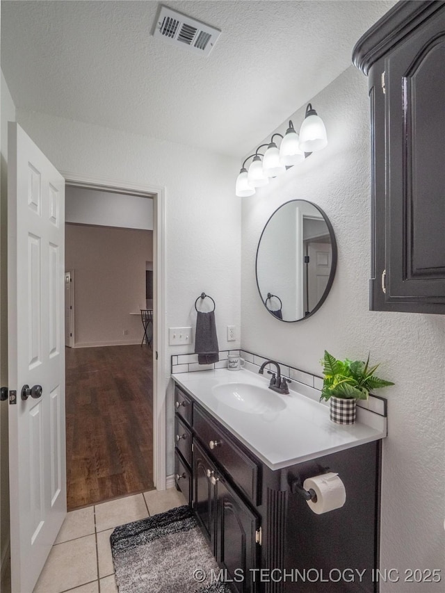 3404 N Birch, Mcalester, OK 74501 - bathroom with vanity, tile patterned flooring, a textured wall, and a textured ceiling