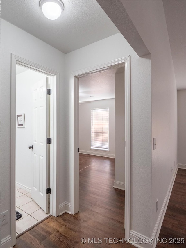 3404 N Birch, Mcalester, OK 74501 - corridor featuring wood finished floors and baseboards