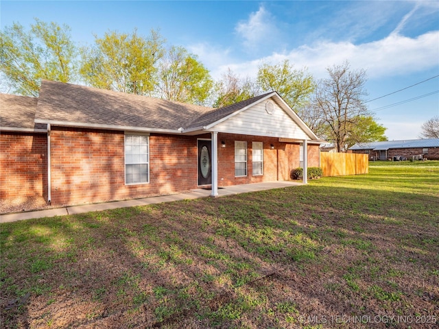 3404 N Birch, Mcalester, OK 74501 - rear view of property with a patio, brick siding, and roof with shingles