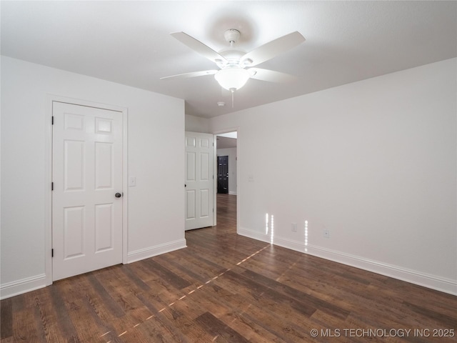 3404 N Birch, Mcalester, OK 74501 - unfurnished bedroom with dark wood-style flooring and ceiling fan