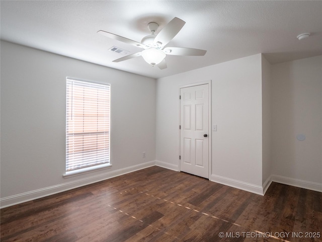 3404 N Birch, Mcalester, OK 74501 - unfurnished room featuring dark wood-type flooring, a ceiling fan, and a smoke detector