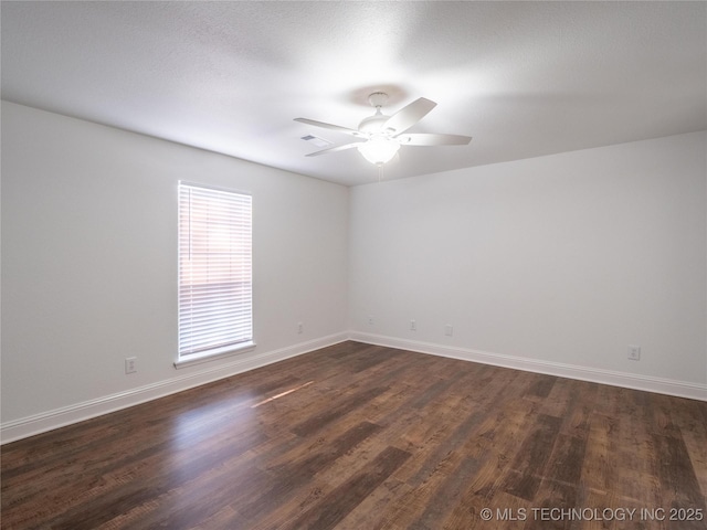 3404 N Birch, Mcalester, OK 74501 - spare room with dark wood-style flooring and a ceiling fan