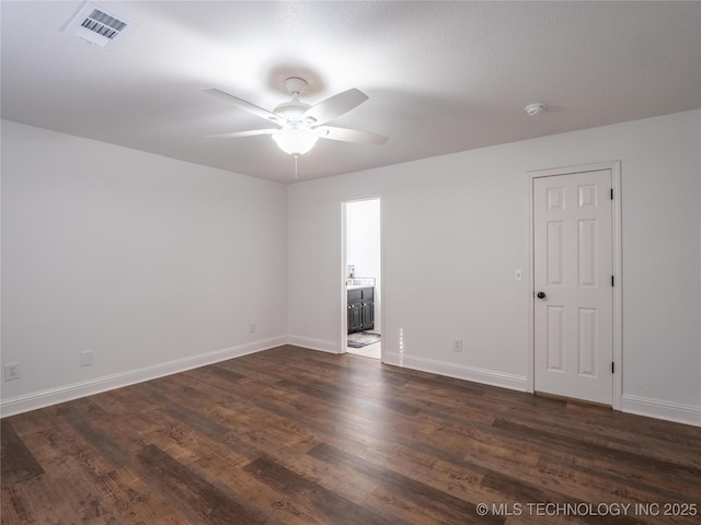 3404 N Birch, Mcalester, OK 74501 - empty room featuring a ceiling fan and dark wood-style floors