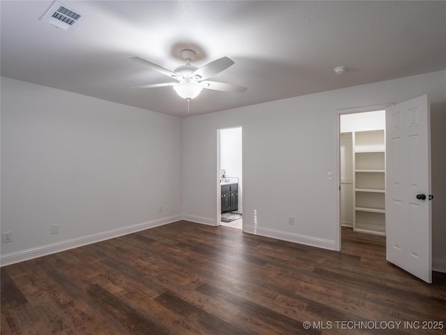 3404 N Birch, Mcalester, OK 74501 - unfurnished room featuring ceiling fan and dark wood-style flooring