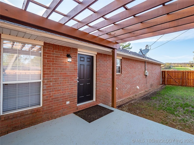 3404 N Birch, Mcalester, OK 74501 - entrance to property with brick siding, a patio, and a pergola