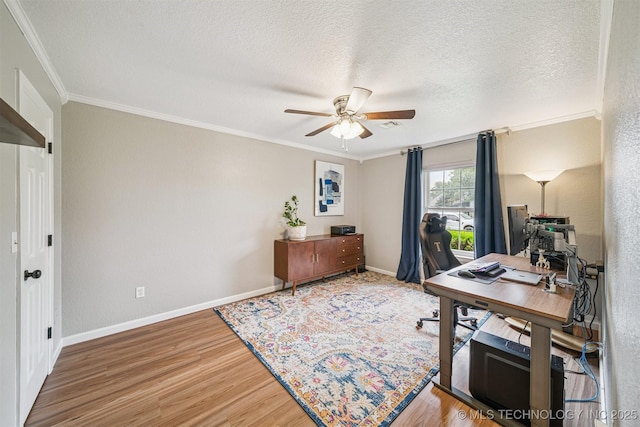 11017 E 98th St N, Owasso, OK 74055 - home office with ceiling fan, crown molding, wood finished floors, and a textured ceiling