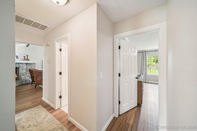 11017 E 98th St N, Owasso, OK 74055 - hall featuring wood finished floors and baseboards