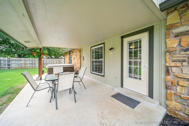 11017 E 98th St N, Owasso, OK 74055 - view of patio featuring a hot tub and outdoor dining space