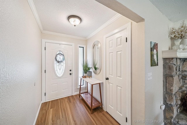 11017 E 98th St N, Owasso, OK 74055 - entryway with a textured ceiling, light wood-type flooring, and ornamental molding