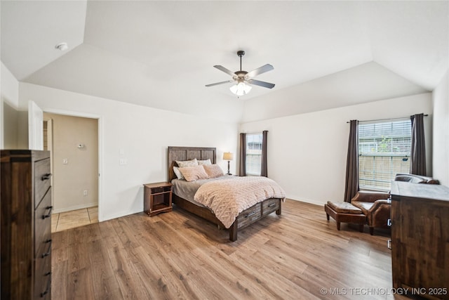 10220 N 119th E Ave, Owasso, OK 74055 - bedroom featuring lofted ceiling, light wood-style flooring, and ceiling fan