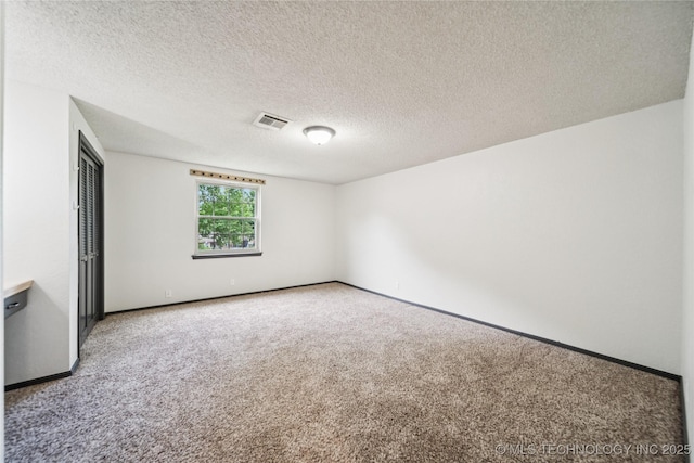 6103 S 223rd E Ave, Broken Arrow, OK 74014 - carpeted empty room featuring baseboards and a textured ceiling