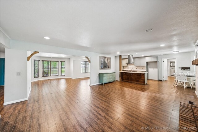 6103 S 223rd E Ave, Broken Arrow, OK 74014 - unfurnished living room featuring recessed lighting and dark wood-type flooring