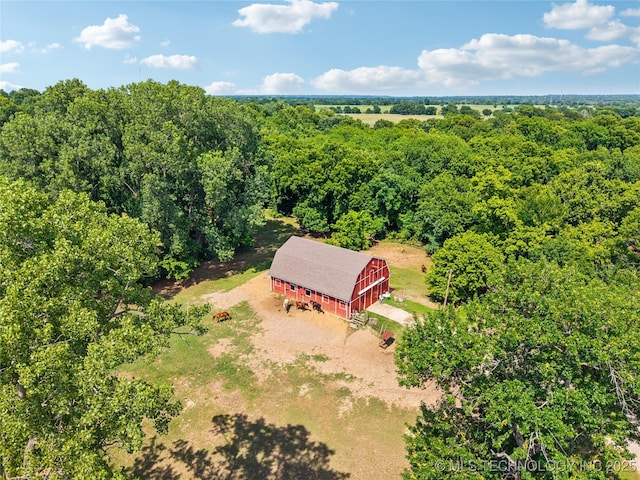 6103 S 223rd E Ave, Broken Arrow, OK 74014 - aerial view of property and surrounding area featuring a heavily wooded area