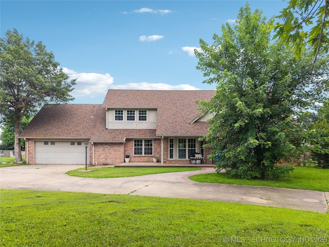 6103 S 223rd E Ave, Broken Arrow, OK 74014 - view of front of home featuring concrete driveway, a front yard, an attached garage, and brick siding