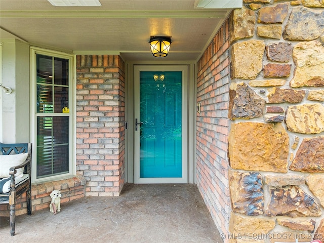 6103 S 223rd E Ave, Broken Arrow, OK 74014 - doorway to property with brick siding and a porch
