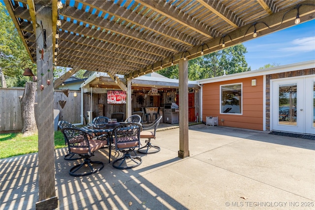 61112 E 310, Grove, OK 74344 - view of patio featuring a pergola, outdoor dining area, and grilling area