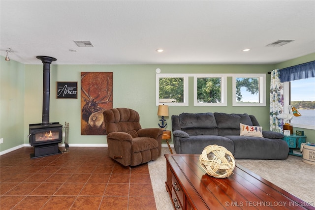 61112 E 310, Grove, OK 74344 - tiled living area featuring a wood stove and recessed lighting