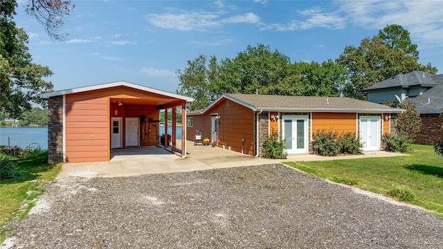 61112 E 310, Grove, OK 74344 - view of front of property featuring driveway, french doors, and a carport
