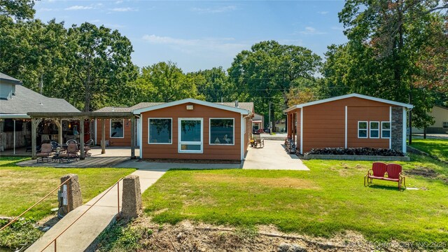 61112 E 310, Grove, OK 74344 - rear view of property featuring a patio and a lawn