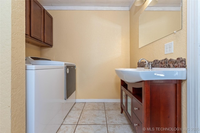 61112 E 310, Grove, OK 74344 - laundry room featuring washer and dryer, cabinet space, light tile patterned floors, and a textured wall