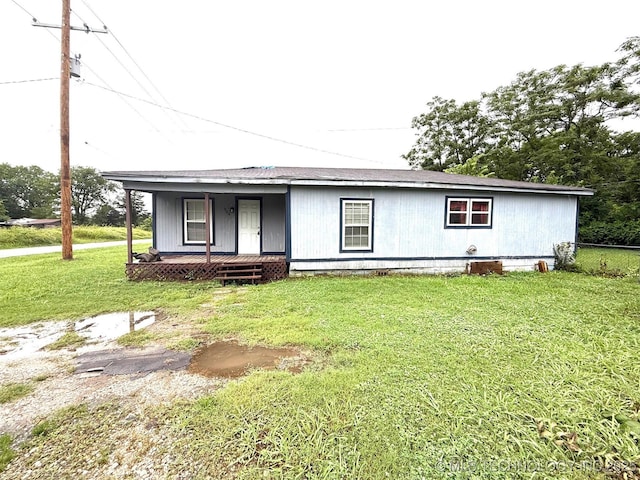904 W Corporation St, Henryetta, OK 74437 - ranch-style home featuring a porch