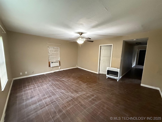 904 W Corporation St, Henryetta, OK 74437 - spare room featuring heating unit, ceiling fan, cooling unit, and dark wood finished floors