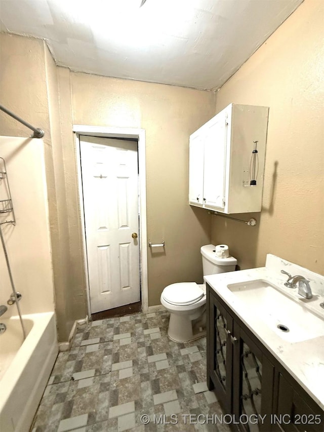 904 W Corporation St, Henryetta, OK 74437 - bathroom featuring tile patterned floors, vanity, and tub / shower combination