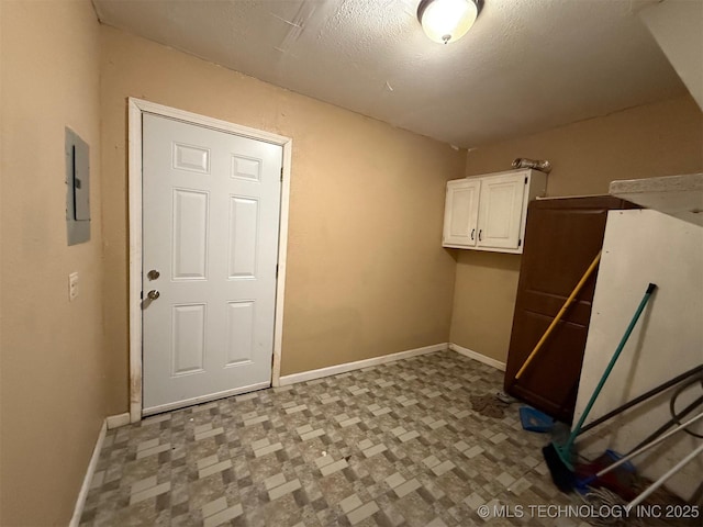904 W Corporation St, Henryetta, OK 74437 - laundry area featuring tile patterned floors and electric panel