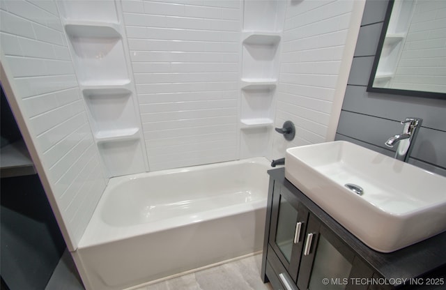 1424 E Okmulgee St, Muskogee, OK 74403 - bathroom with shower / washtub combination, vanity, and wood finished floors