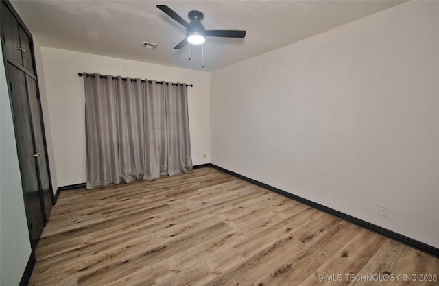 1424 E Okmulgee St, Muskogee, OK 74403 - unfurnished room with wood finished floors and a ceiling fan