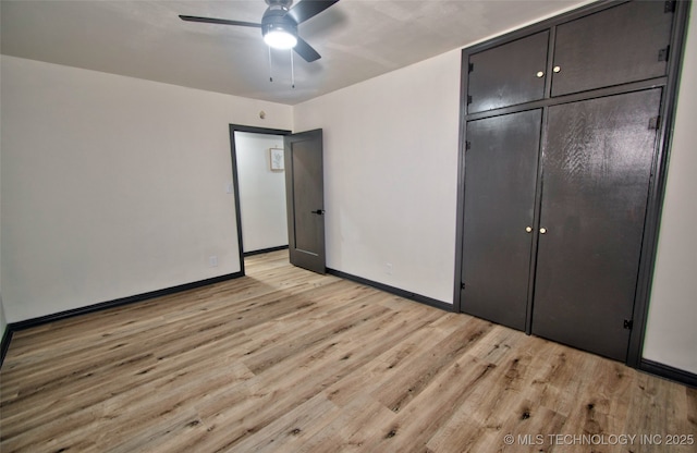 1424 E Okmulgee St, Muskogee, OK 74403 - unfurnished bedroom featuring light wood finished floors, a closet, and ceiling fan