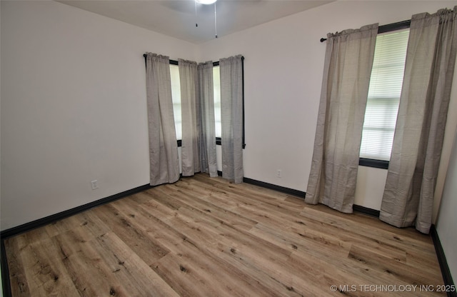1424 E Okmulgee St, Muskogee, OK 74403 - spare room featuring wood finished floors and ceiling fan