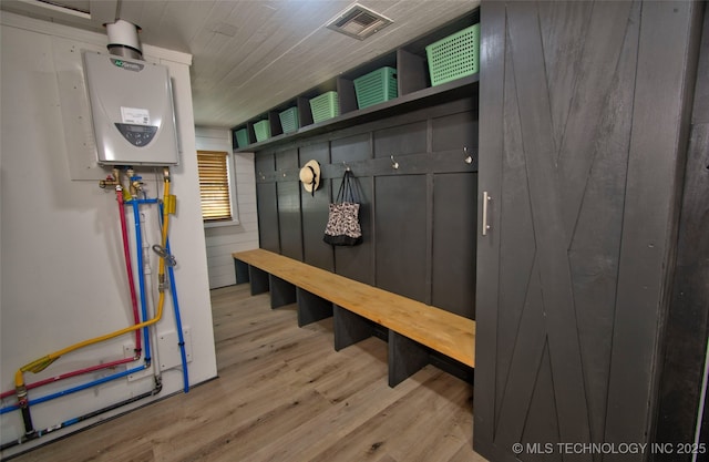 1424 E Okmulgee St, Muskogee, OK 74403 - mudroom with wood finished floors and water heater
